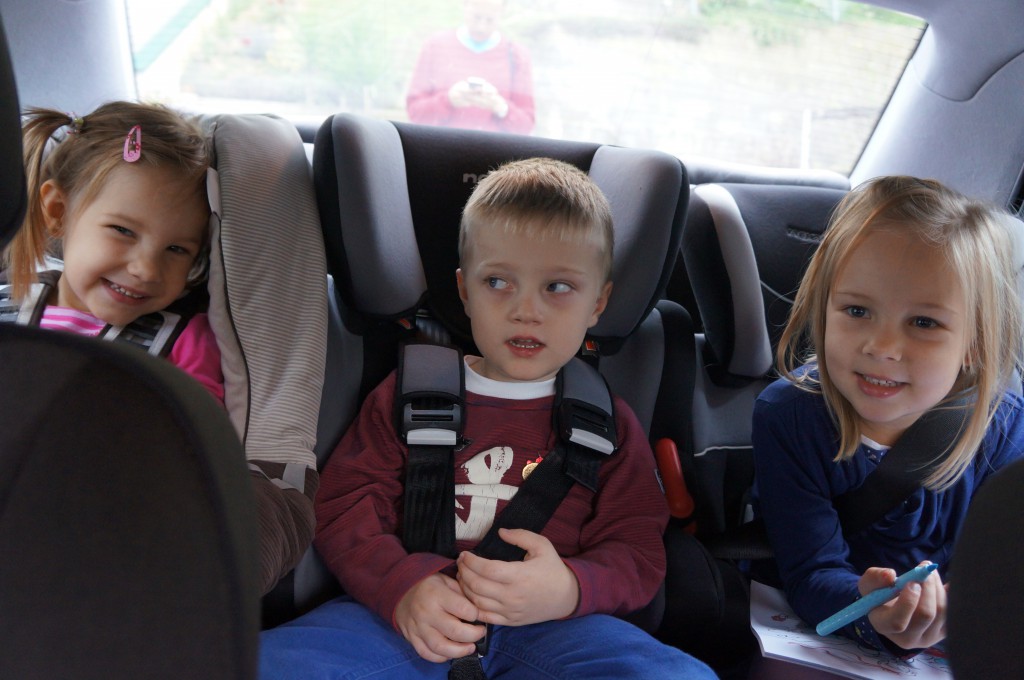 Three child seats in a single car
